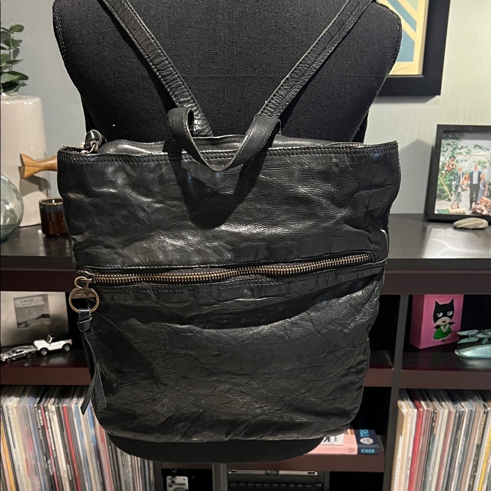 Black leather backpack with top zipper and large front pocket by Margot like new
